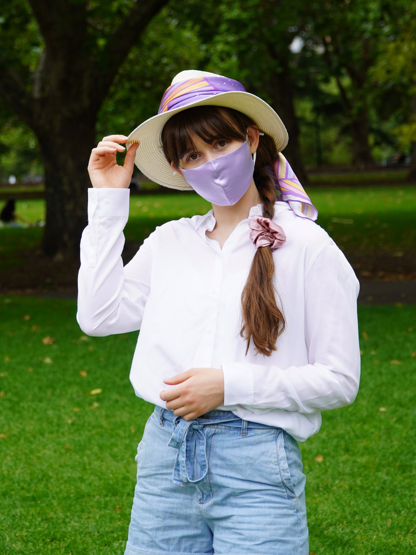 Model wears lilac silk face mask